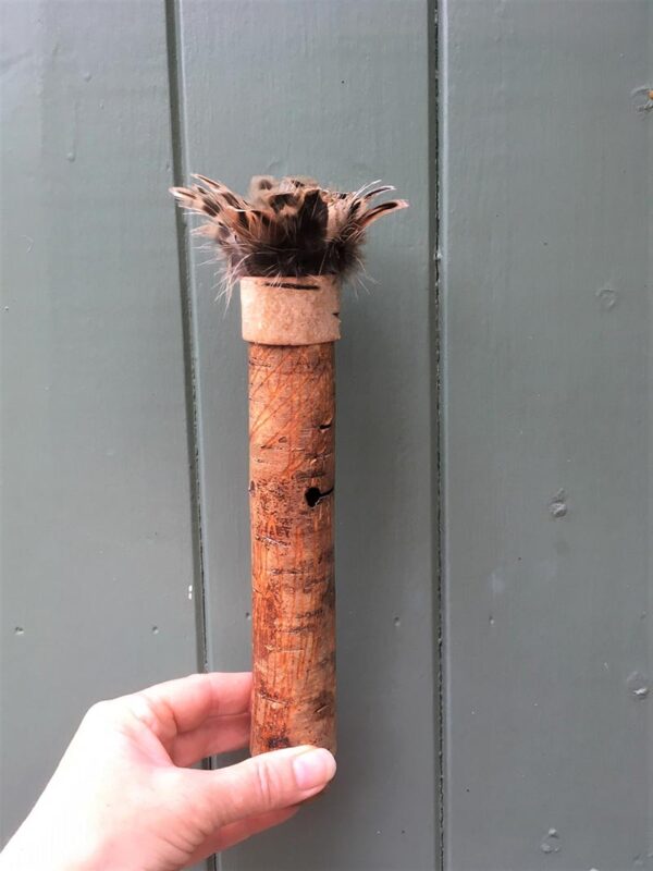 Birch bark vessel with turkey feather rim Ht 25 x 4 cms £42.00